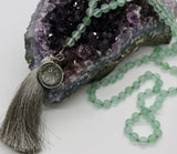 Mala ~ Flourite Mala with Dharma Wheel