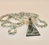 Mala ~ Aquamarine Mala adorned with Triangular Buddha Pendant